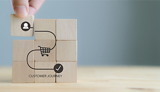blocks showing customer, shopping cart and checkmark icons