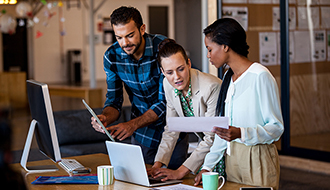 three coworkers problem-solving together