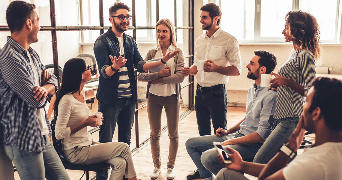 a sales/marketing team having coffee together