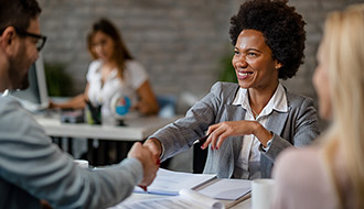 some people sitting at a table discussing business