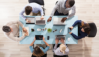 table with coworkers working together